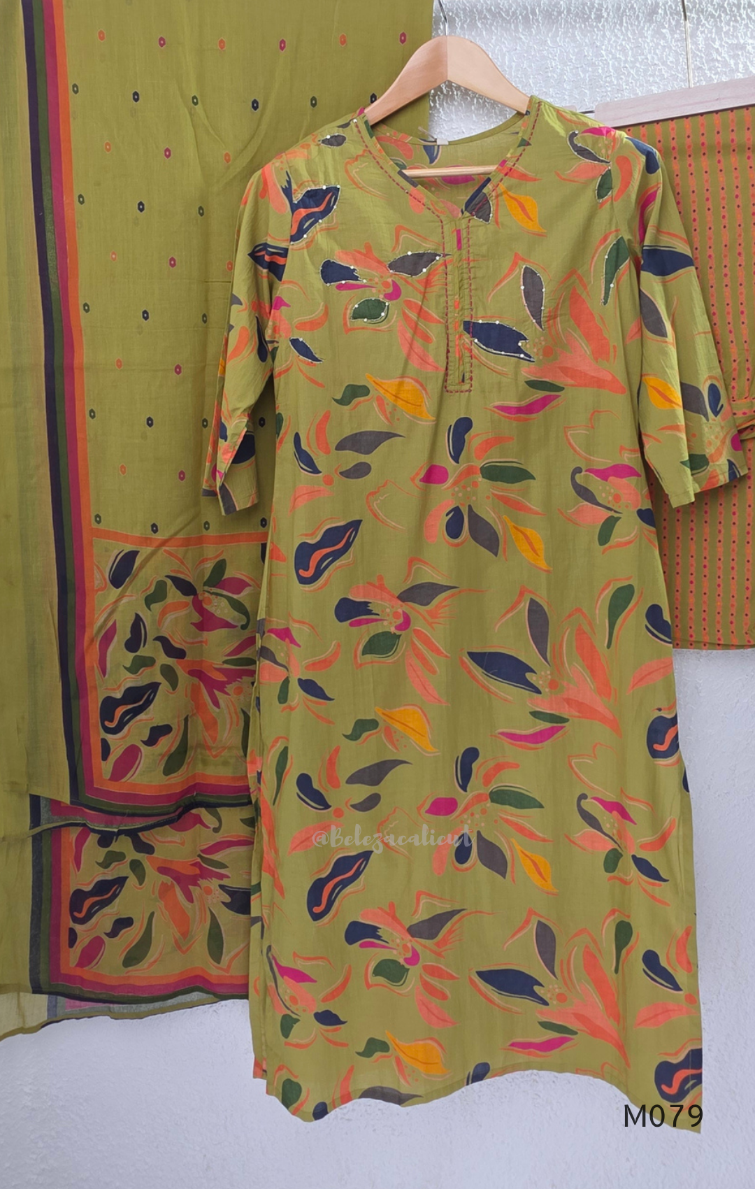 Olive green Jaipur cotton 3-piece churidar set with multicolour floral print, contrast dupatta, and printed straight bottom.