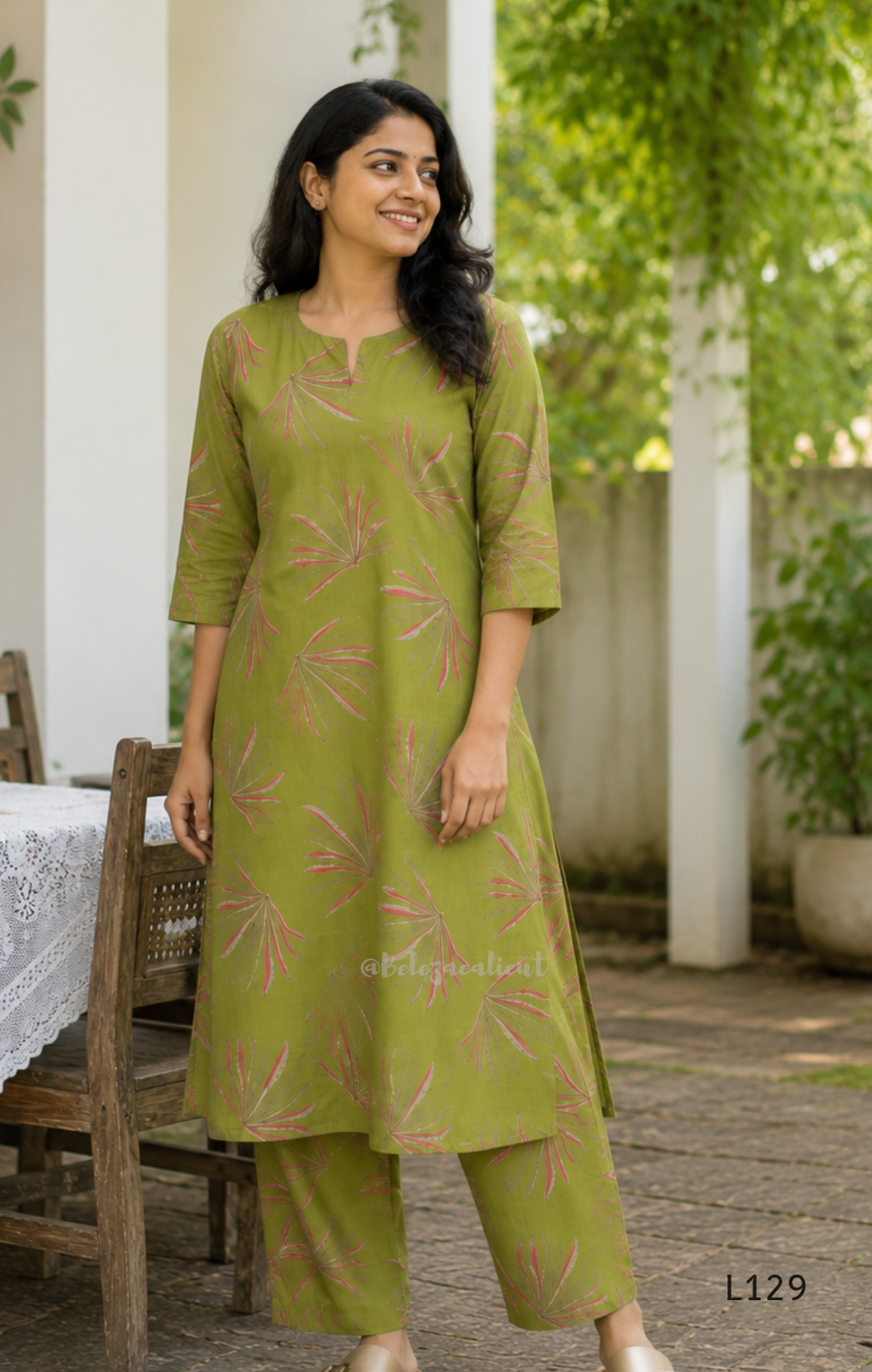 Olive green silk blend 2-piece kurti set with pink and beige leaf print, short sleeve A-line kurti and matching straight pant.