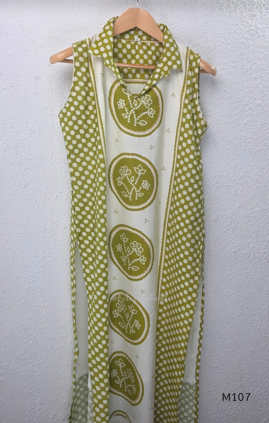 Olive green and ivory silk blend long kurta with botanical medallion centre print, small ring-pattern side panels and shirt collar.