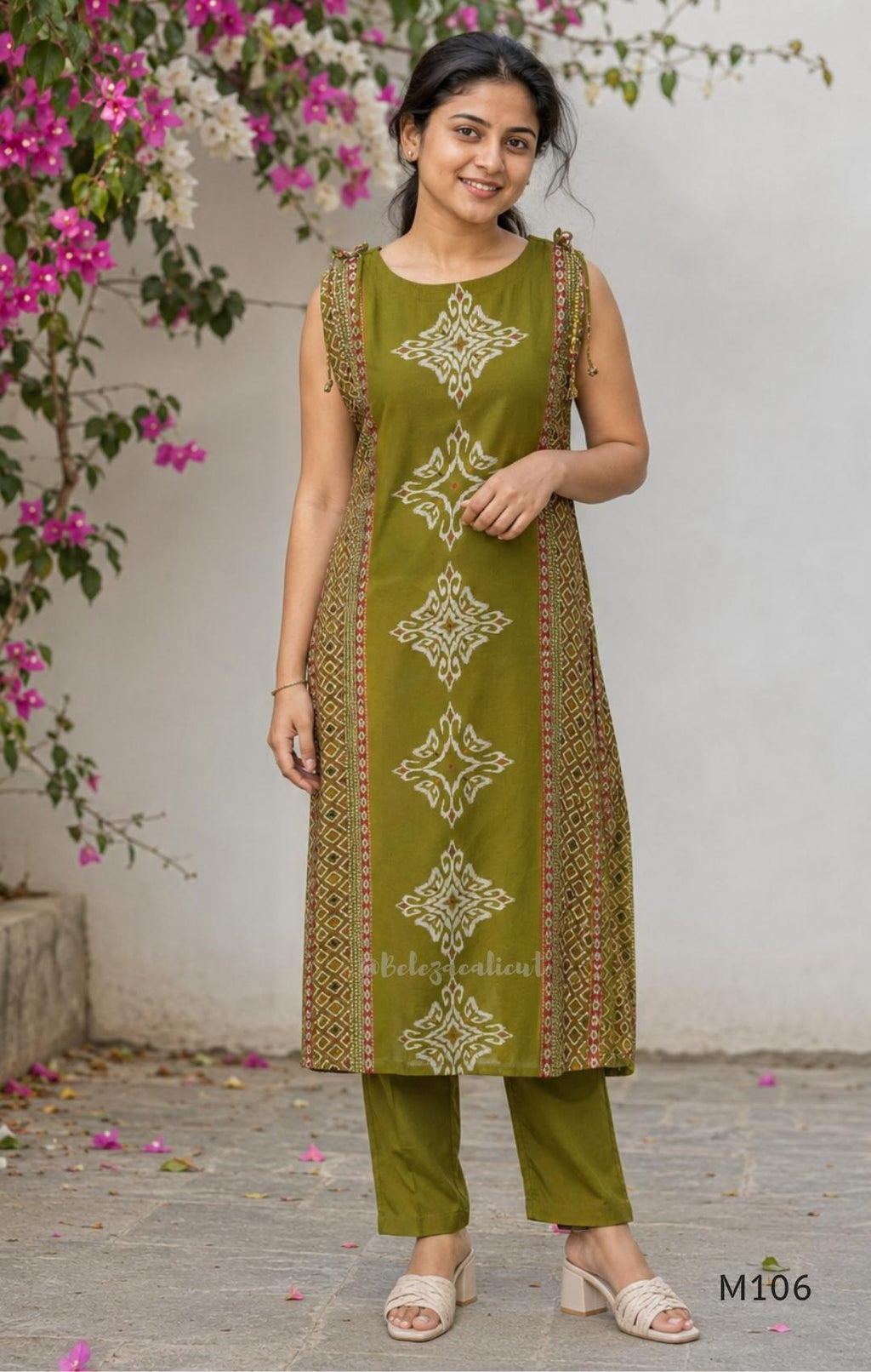 Olive green vertigan silk 2-piece set with straight kurta, white motif work, printed border panels and matching bottom.