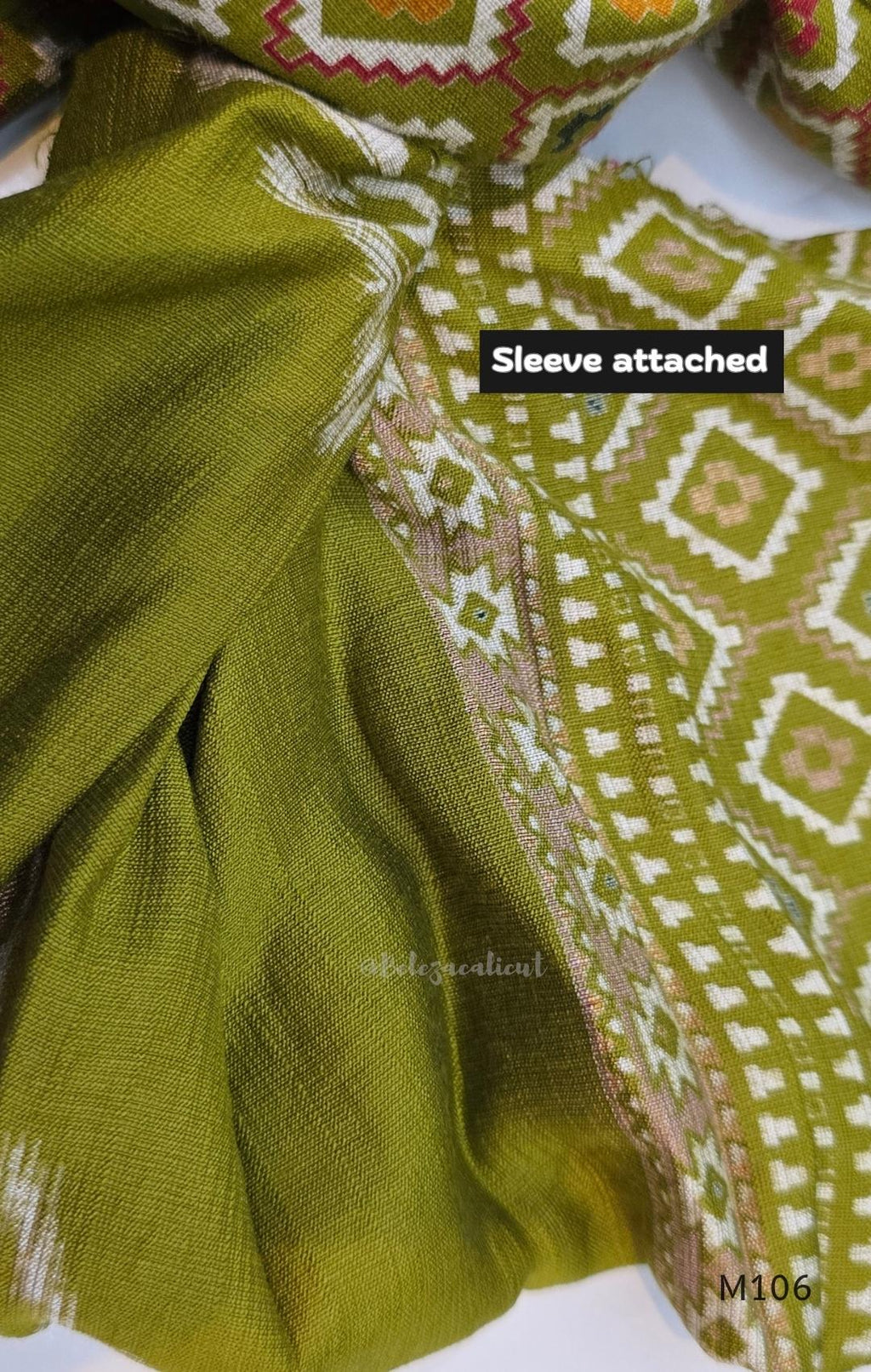 Olive green vertigan silk 2-piece set with straight kurta, white motif work, printed border panels and matching bottom.
