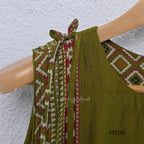 Olive green vertigan silk 2-piece set with straight kurta, white motif work, printed border panels and matching bottom.