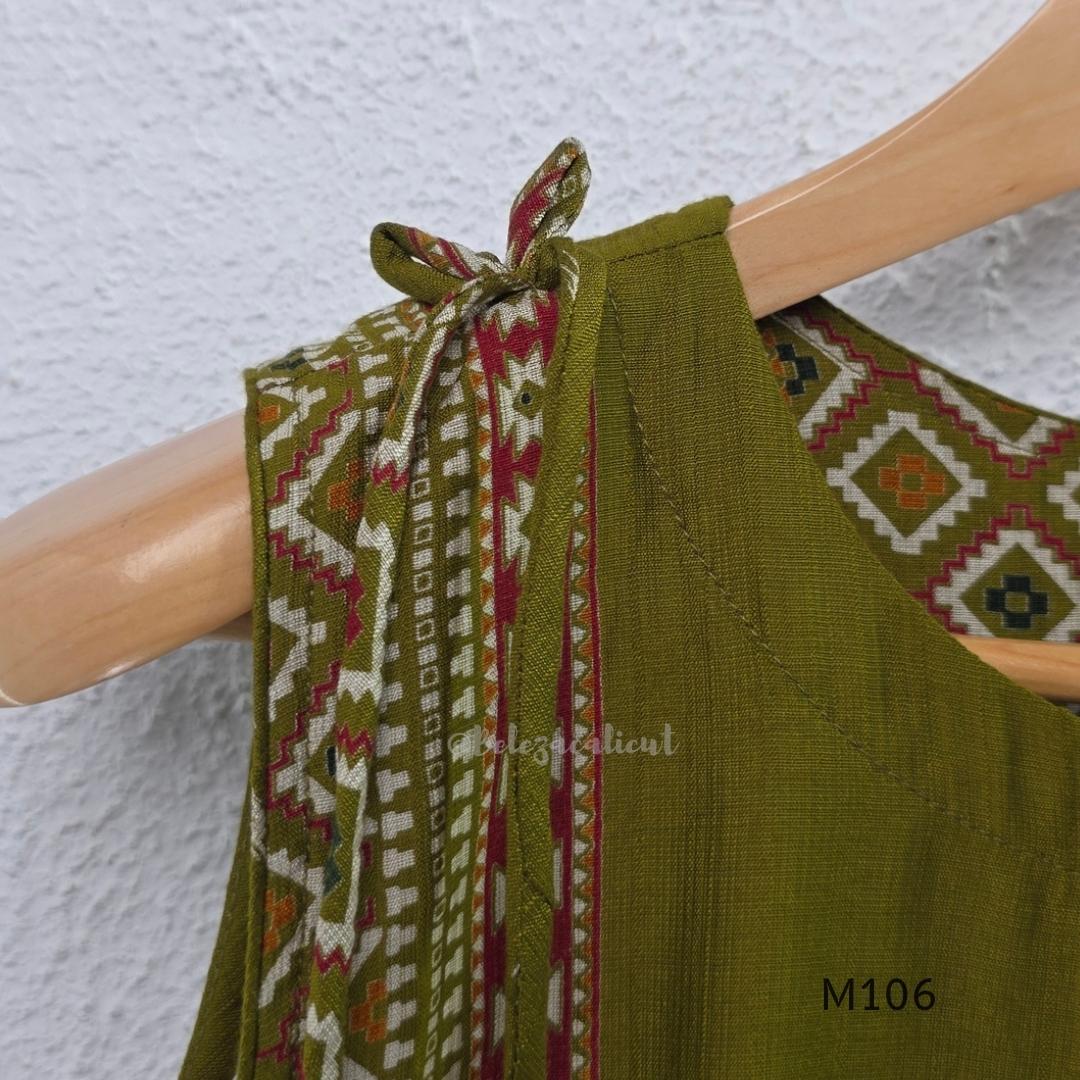 Olive green vertigan silk 2-piece set with straight kurta, white motif work, printed border panels and matching bottom.
