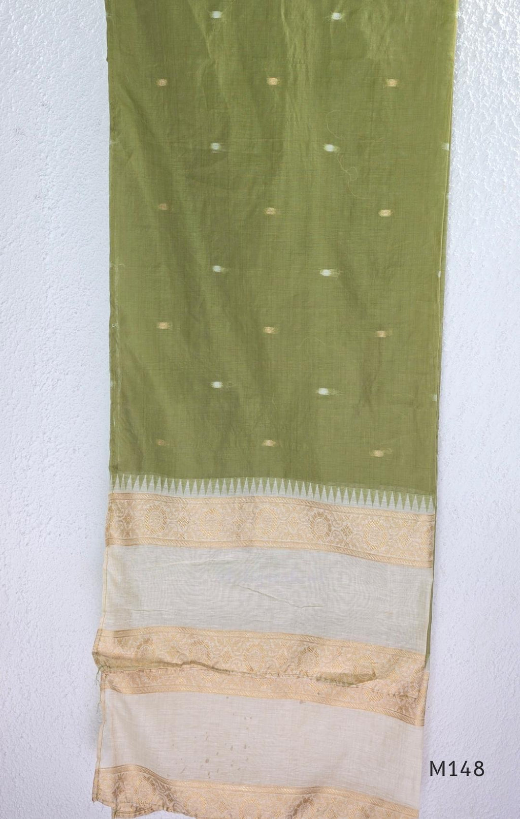 Olive green and ivory tissue blend churidar set with gold woven borders, scattered motifs, straight bottom and matching dupatta.