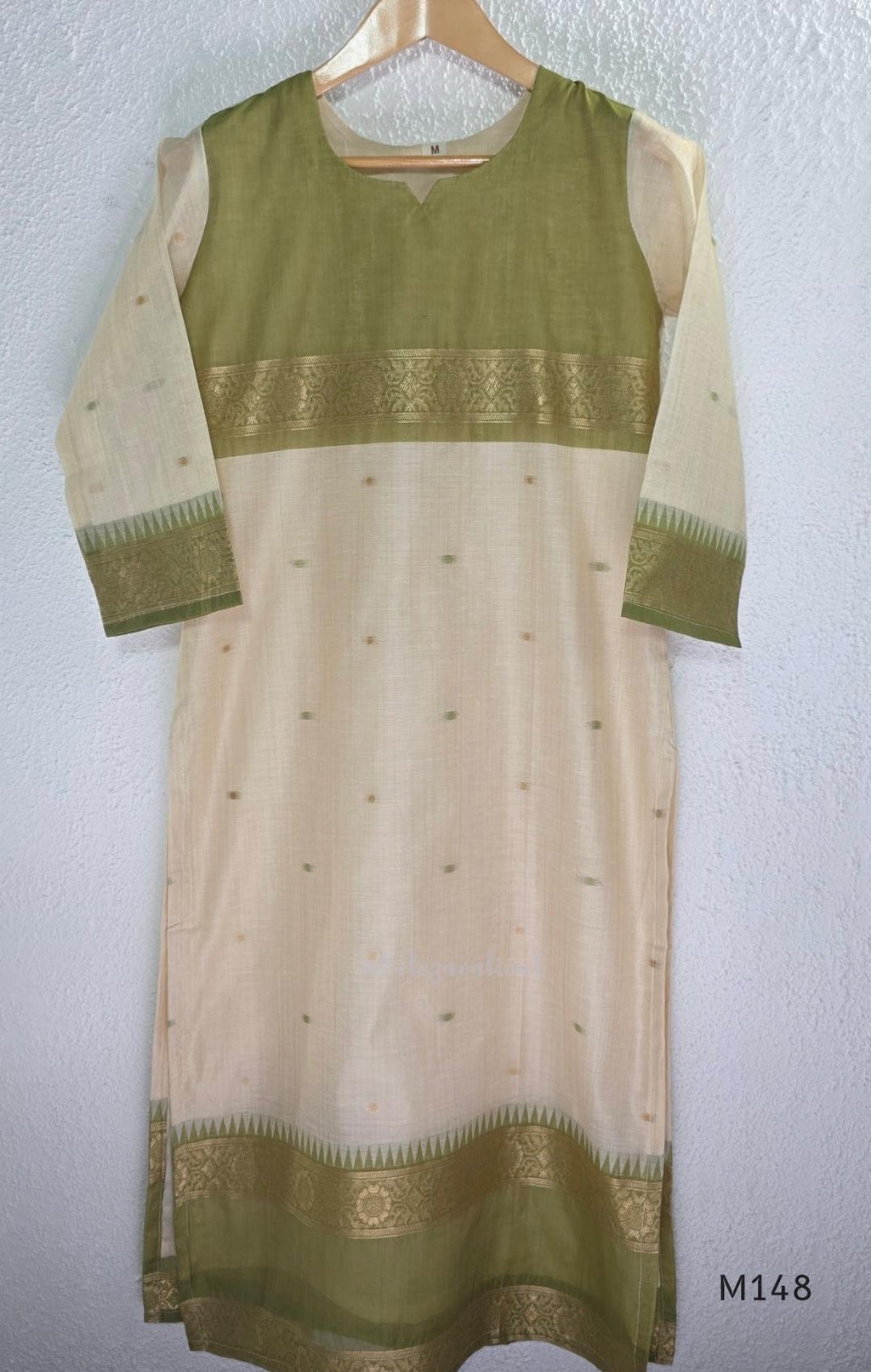 Olive green and ivory tissue blend churidar set with gold woven borders, scattered motifs, straight bottom and matching dupatta.