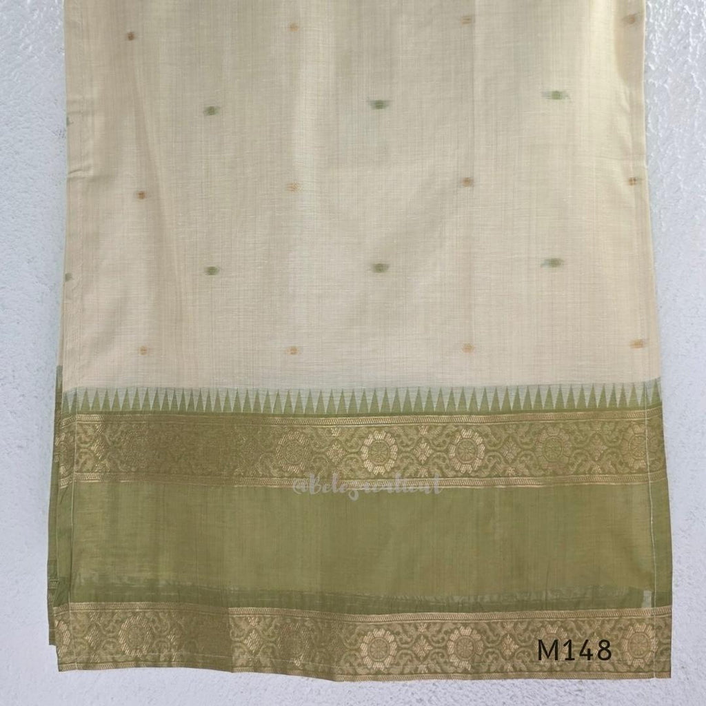 Olive green and ivory tissue blend churidar set with gold woven borders, scattered motifs, straight bottom and matching dupatta.