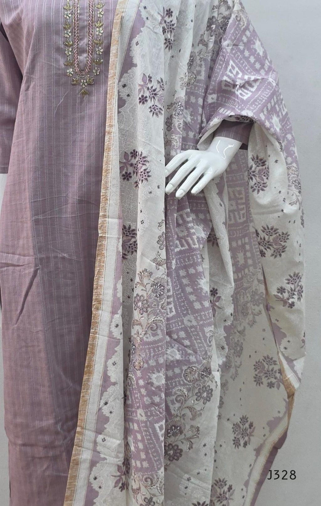 Onion mauve cotton churidar set Kerala with checked kurti, beadwork neckline, matching bottom, and cream floral printed dupatta with beige border.
