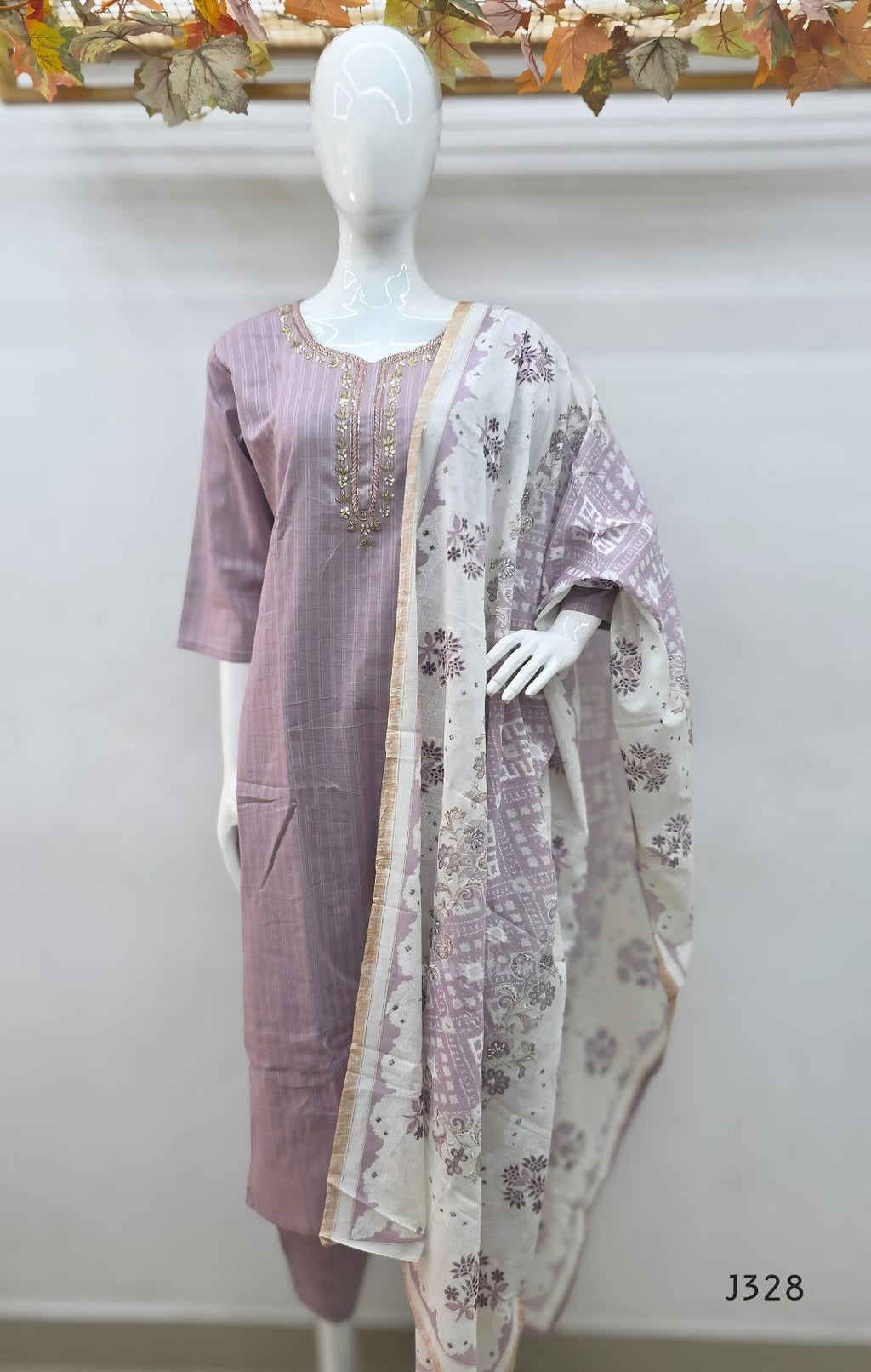 Onion mauve cotton churidar set Kerala with checked kurti, beadwork neckline, matching bottom, and cream floral printed dupatta with beige border.