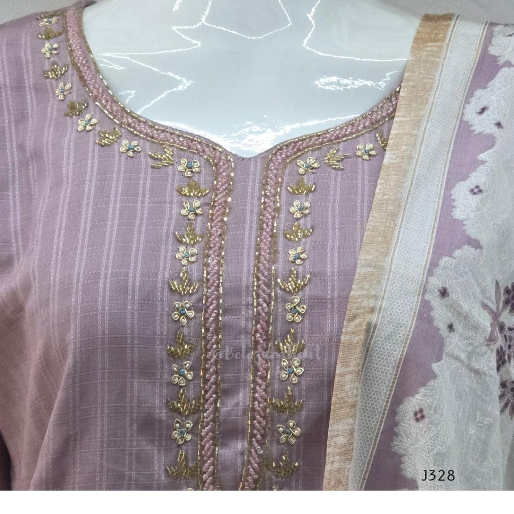Onion mauve cotton churidar set Kerala with checked kurti, beadwork neckline, matching bottom, and cream floral printed dupatta with beige border.