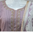 Onion mauve cotton churidar set Kerala with checked kurti, beadwork neckline, matching bottom, and cream floral printed dupatta with beige border.