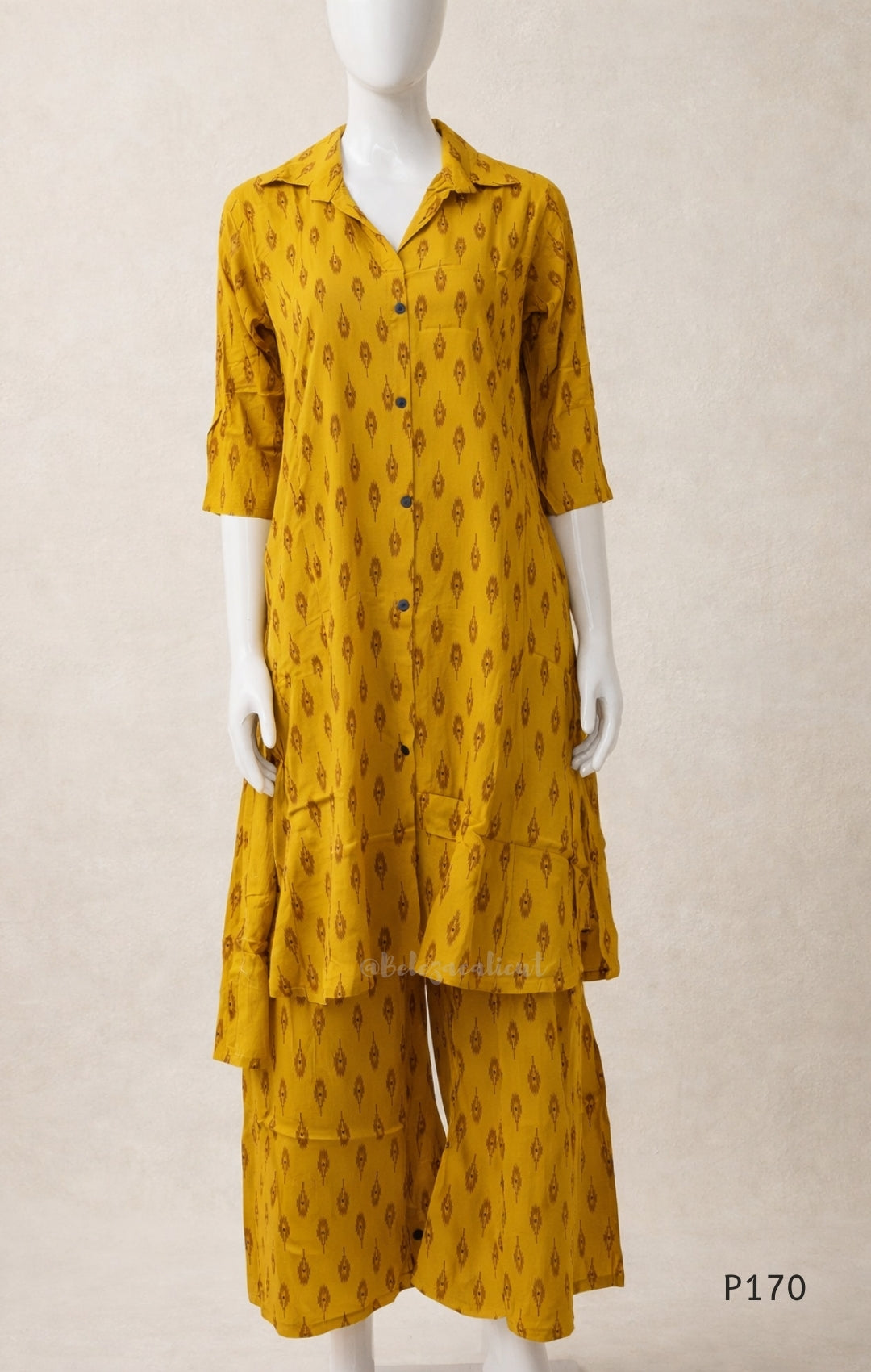 Mustard yellow outfit with a pattern on a mannequin against a beige background
