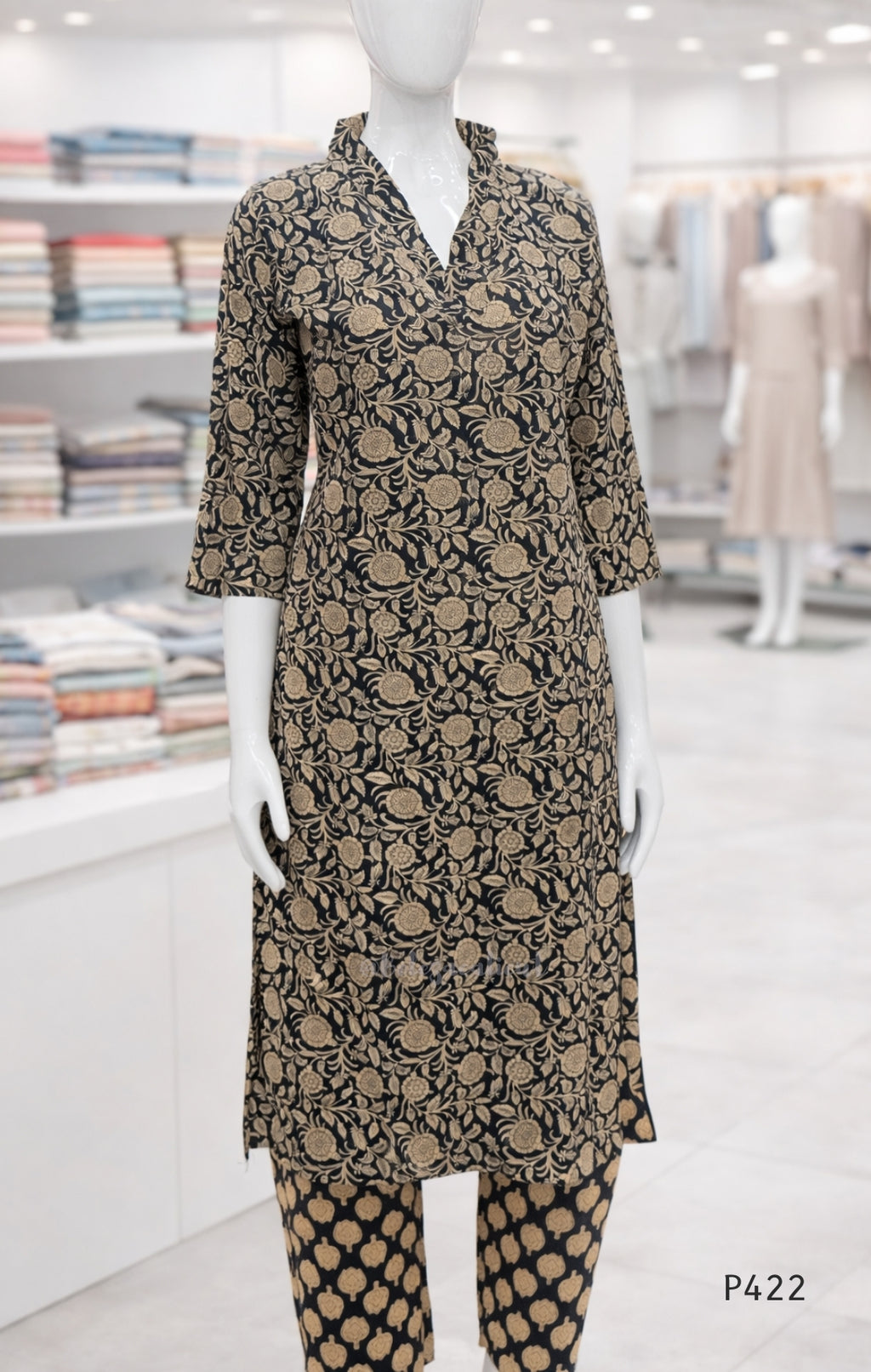 Mannequin wearing a patterned outfit in a store setting