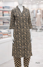 Mannequin wearing a patterned outfit in a store setting