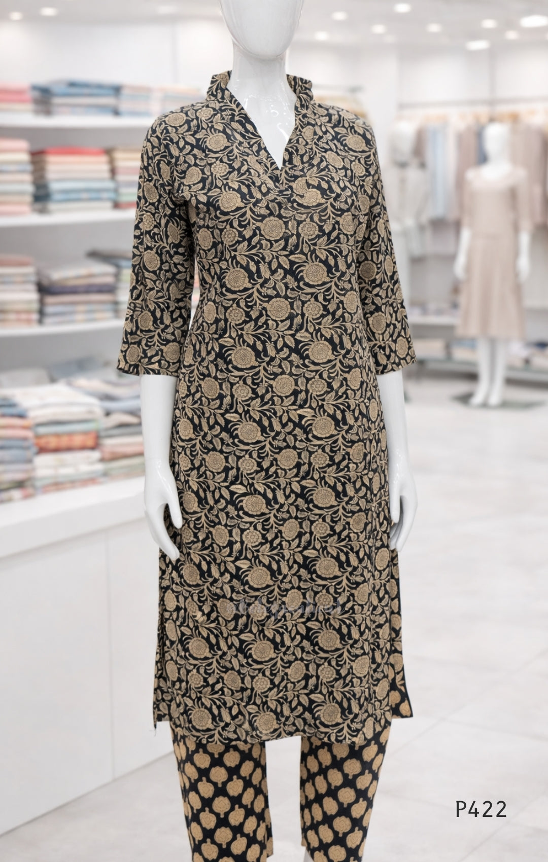 Mannequin wearing a patterned outfit in a store setting