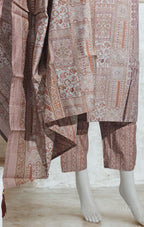 Traditional patterned fabric draped over a mannequin on a light background