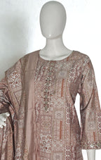 Mannequin wearing a patterned dress with a plain background