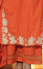 Orange fabric with white floral embroidery and brown lace details