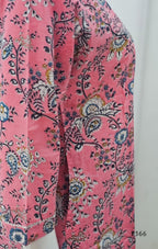 Pink fabric with floral and paisley pattern on a white background