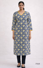 Woman wearing a blue floral kurta with yellow flowers on a white background
