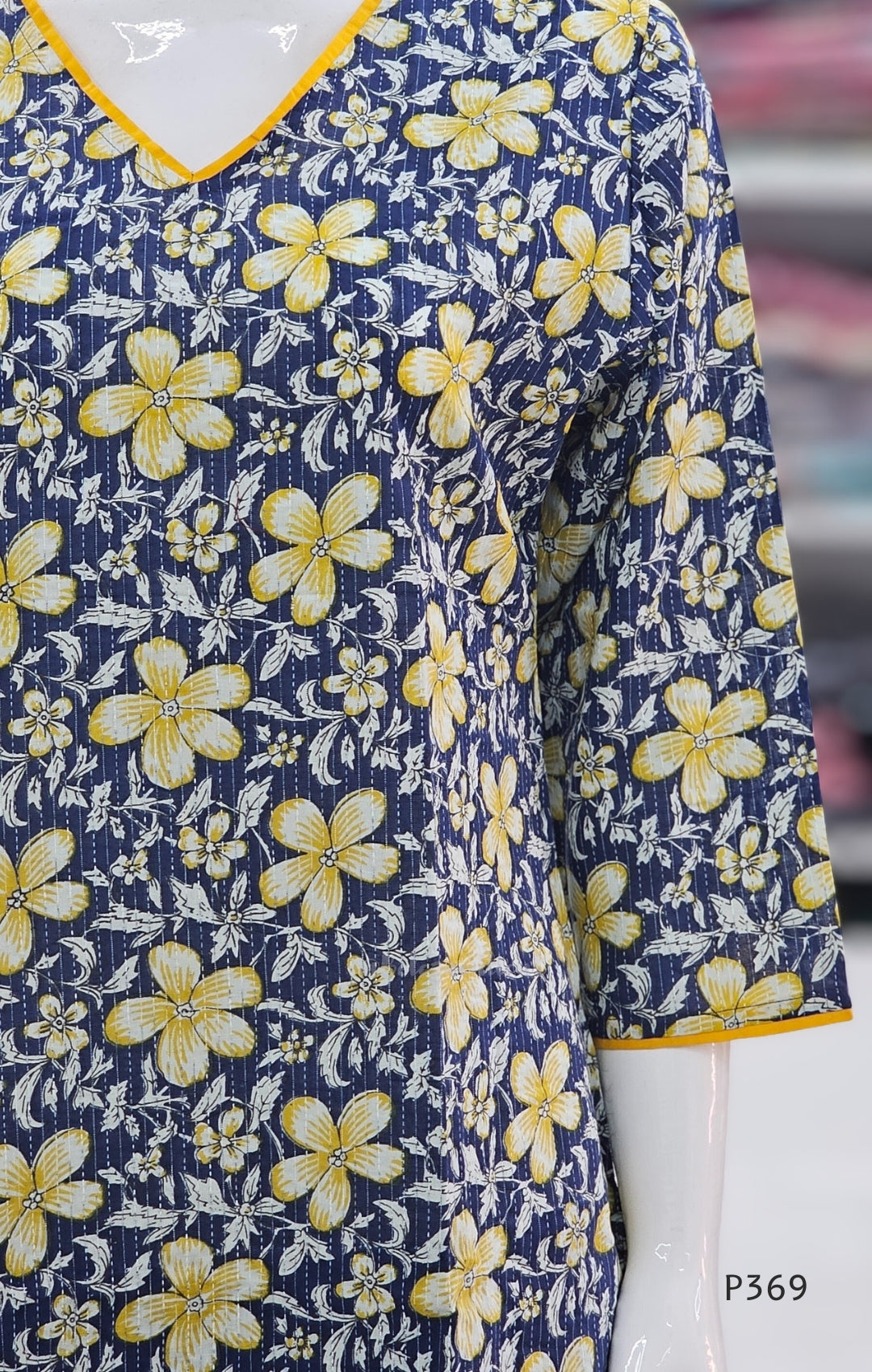 Navy blue fabric with yellow floral pattern