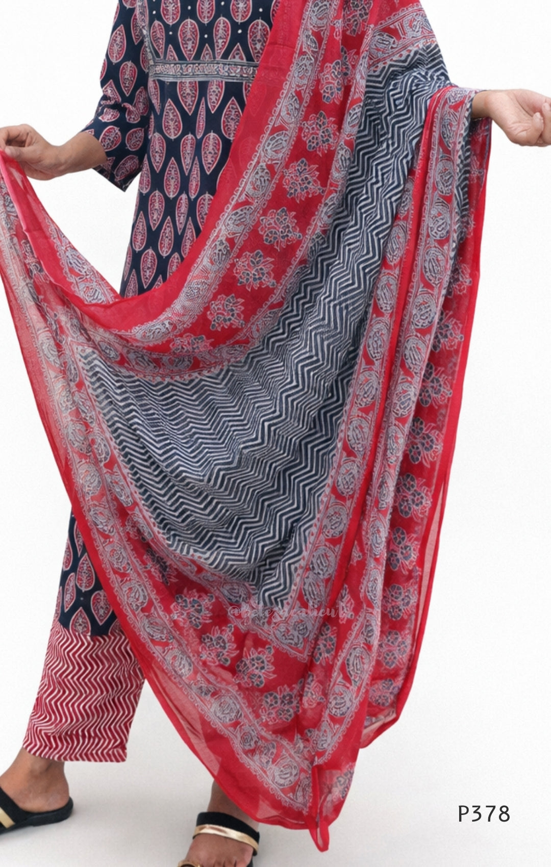 Red and blue patterned dupatta draped over a person on a white background