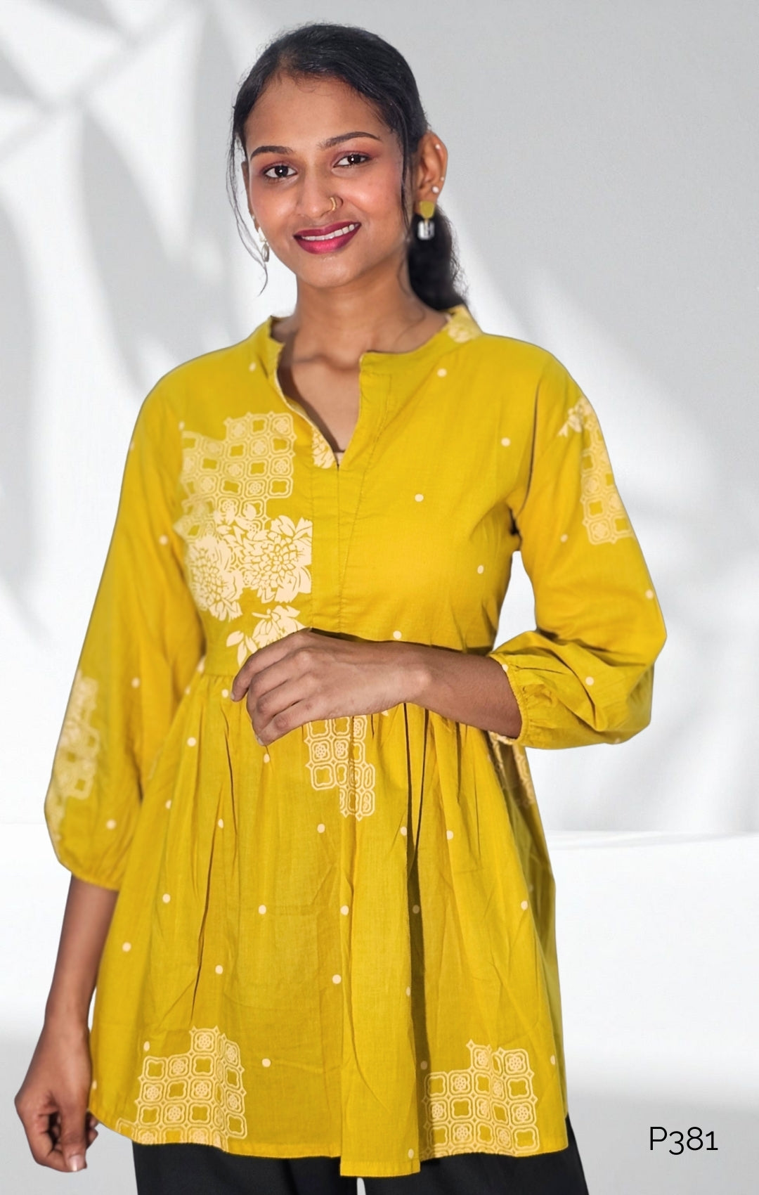 Mustard Cotton Printed Peplum Short Kurti with Floral Motifs
2