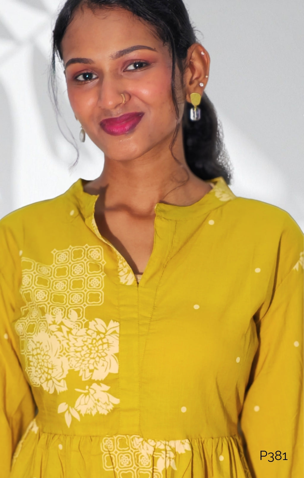 Mustard Cotton Printed Peplum Short Kurti with Floral Motifs
3