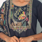 Embroidered traditional garment with intricate designs on a plain background