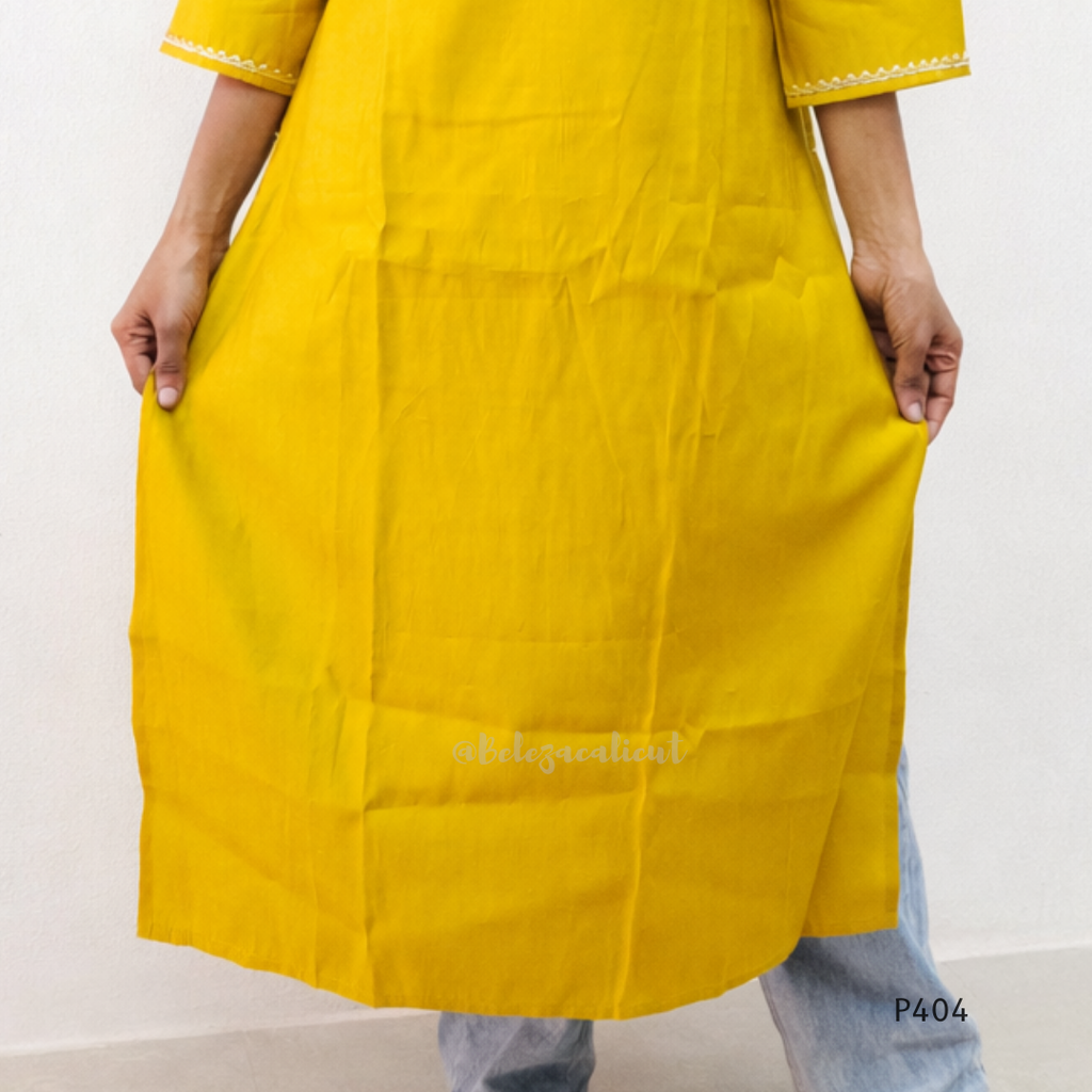 Yellow kurta worn by a person on a white background