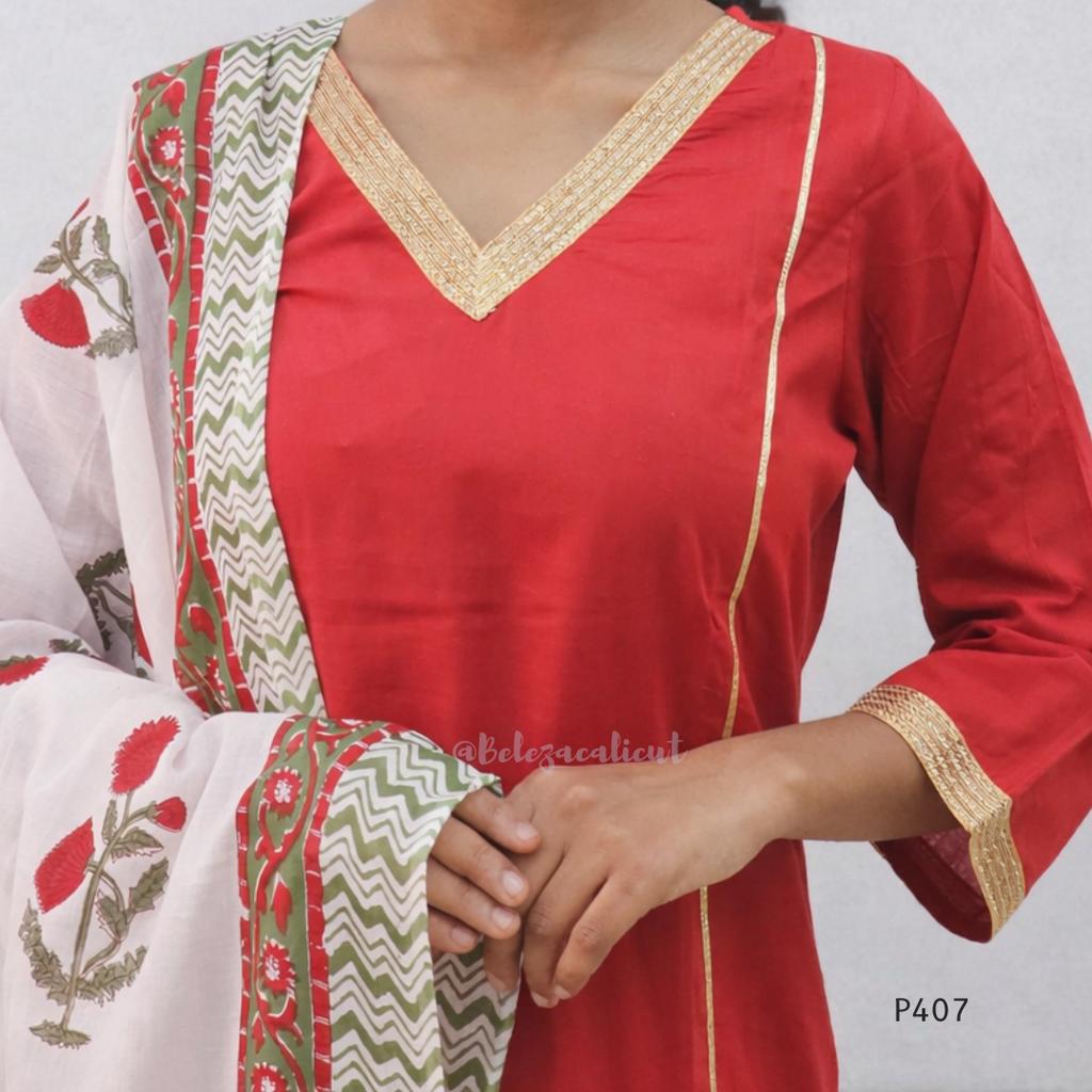Red kurta with white and green embroidered dupatta on a plain background