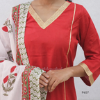 Red kurta with white and green embroidered dupatta on a plain background