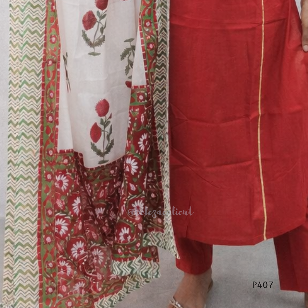 Red traditional outfit with floral patterns on a plain background