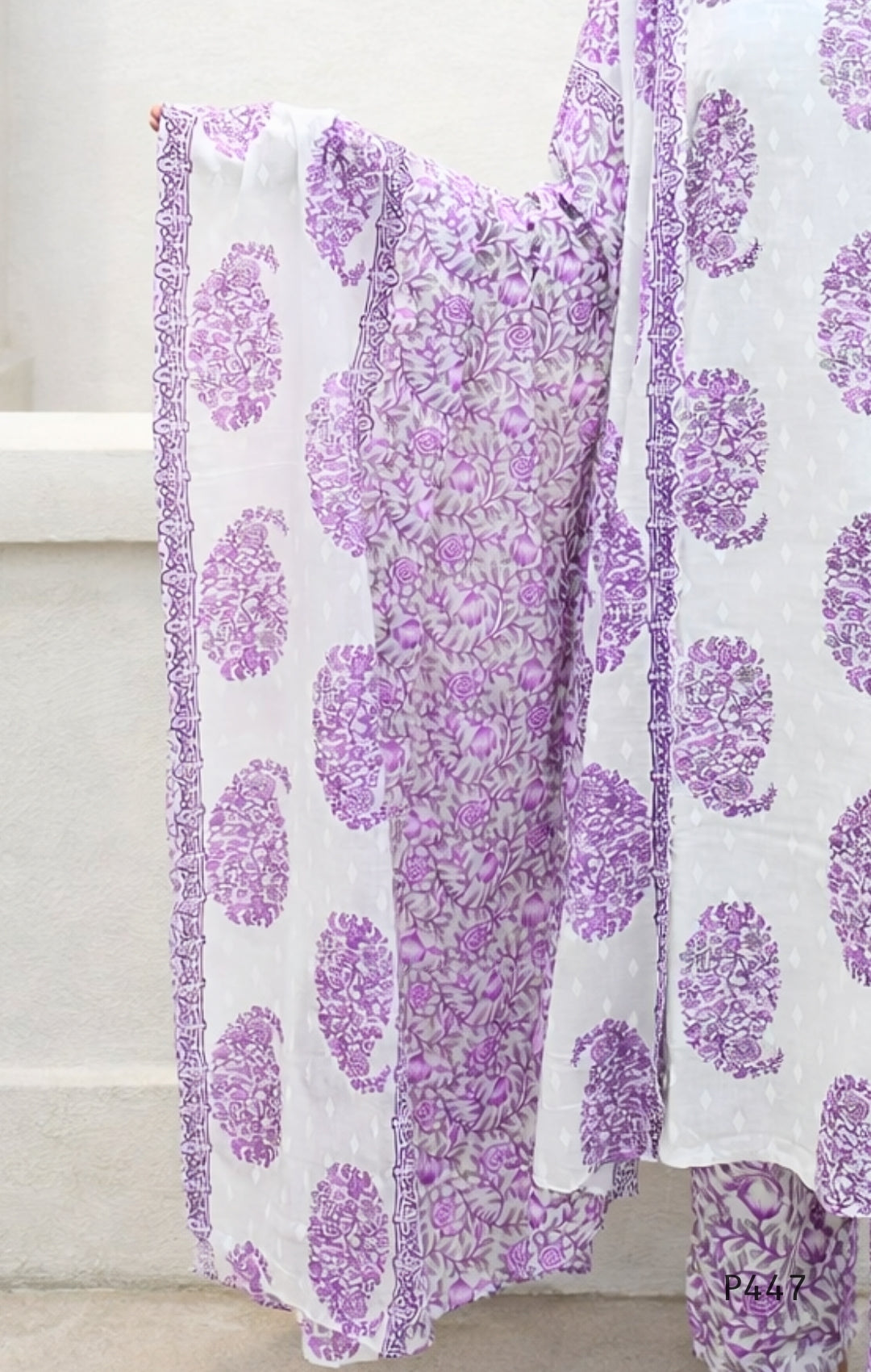 Purple floral patterned fabric on a white background