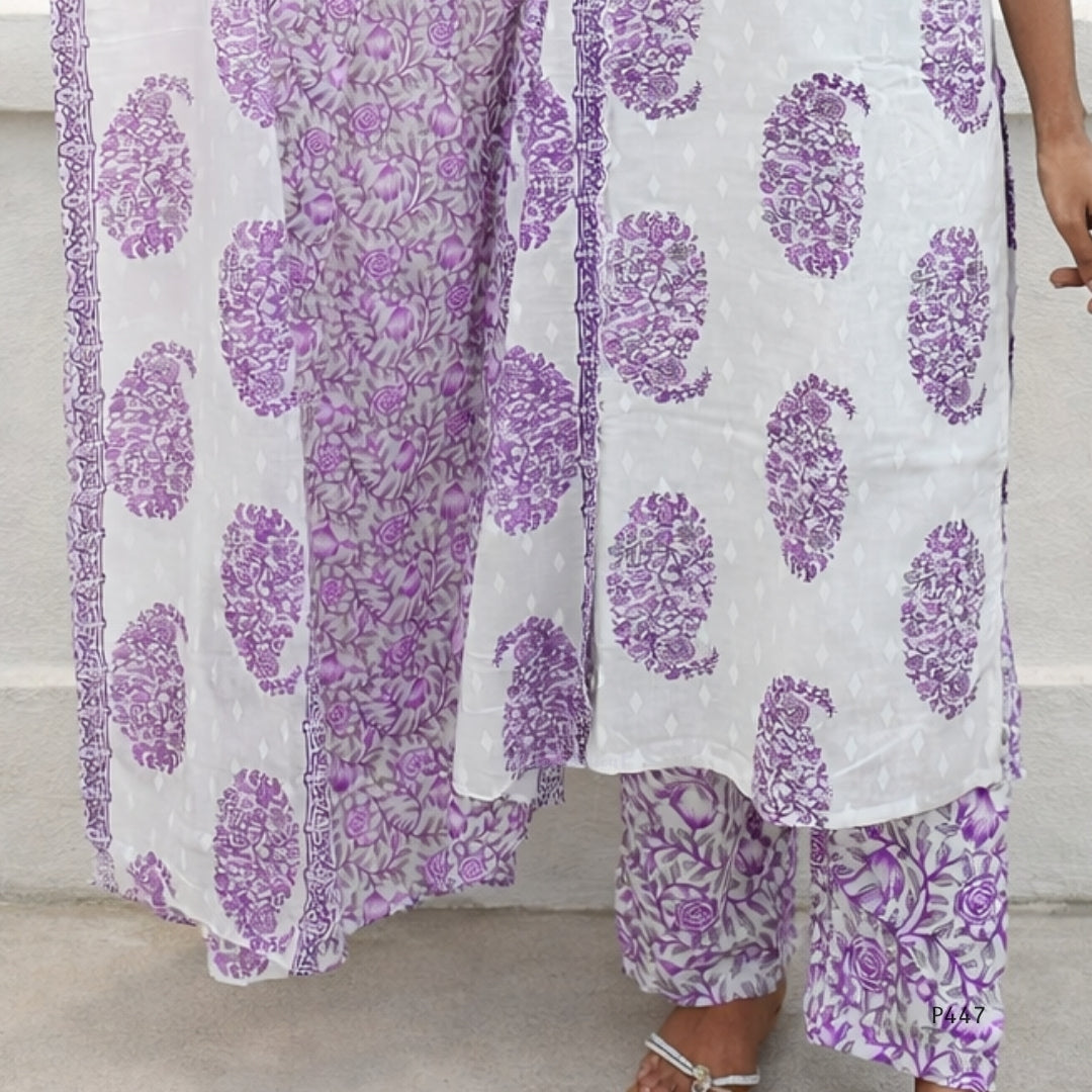 Purple and white floral patterned outfit on a neutral background