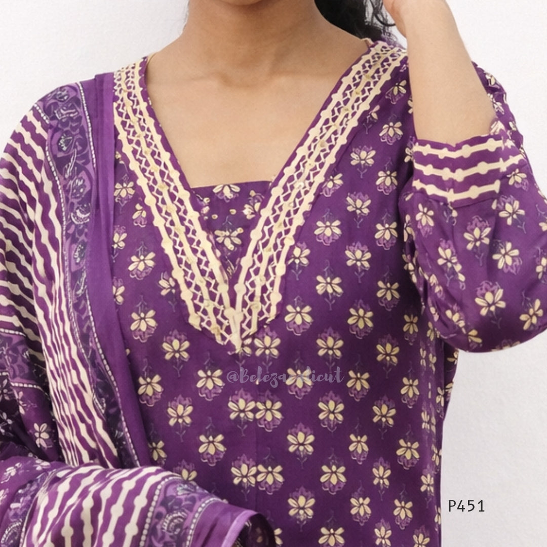 Purple traditional outfit with floral patterns on a white background