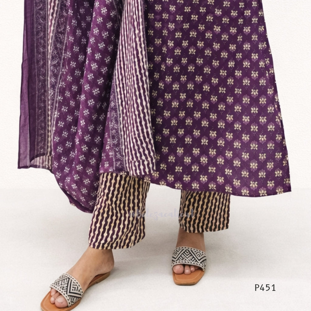 Purple patterned kurta with matching dupatta and black and white pants on a white background