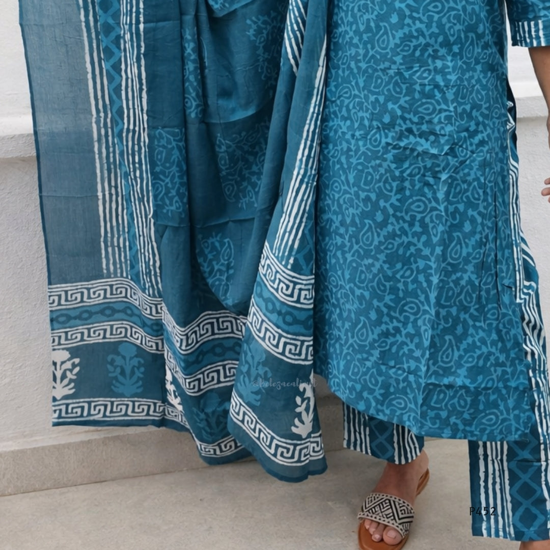 Blue patterned fabric draped over a person on a light background