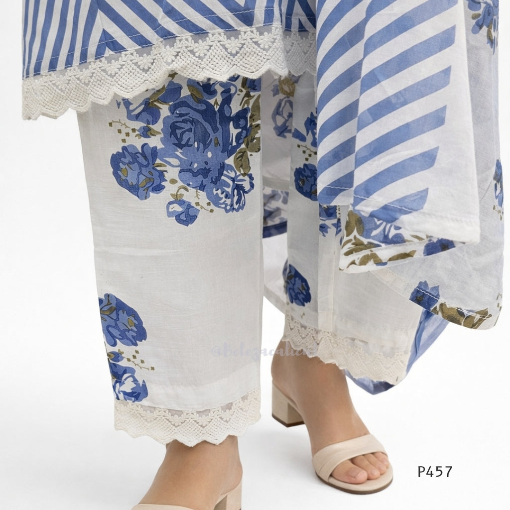 White outfit with blue floral patterns and striped accents on a white background