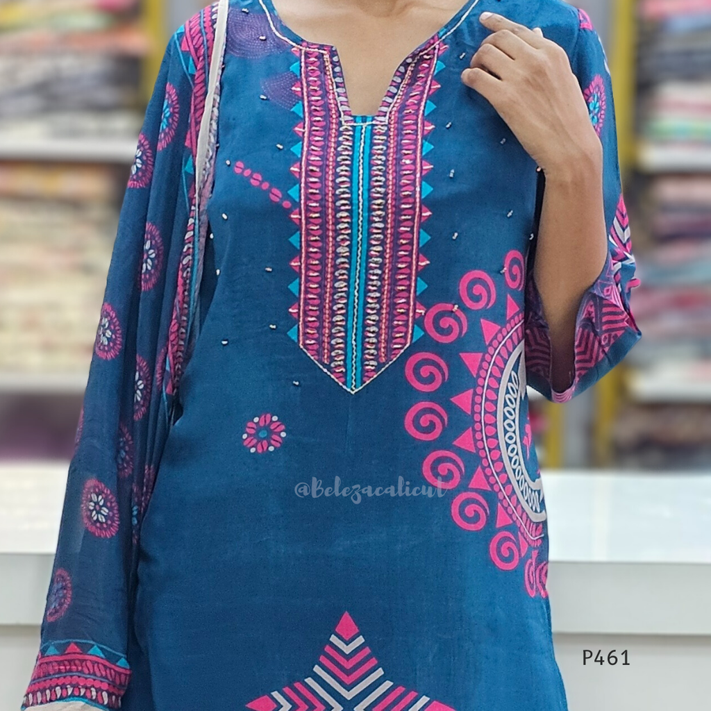 Blue and pink patterned dress with a blurred background