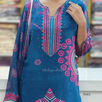 Blue and pink patterned dress with a blurred background