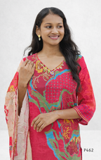 Woman wearing a red traditional outfit with floral patterns on a white background