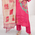 Pink traditional outfit with floral patterns on a white background