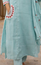 Light blue embroidered outfit with a matching dupatta on a blurred background