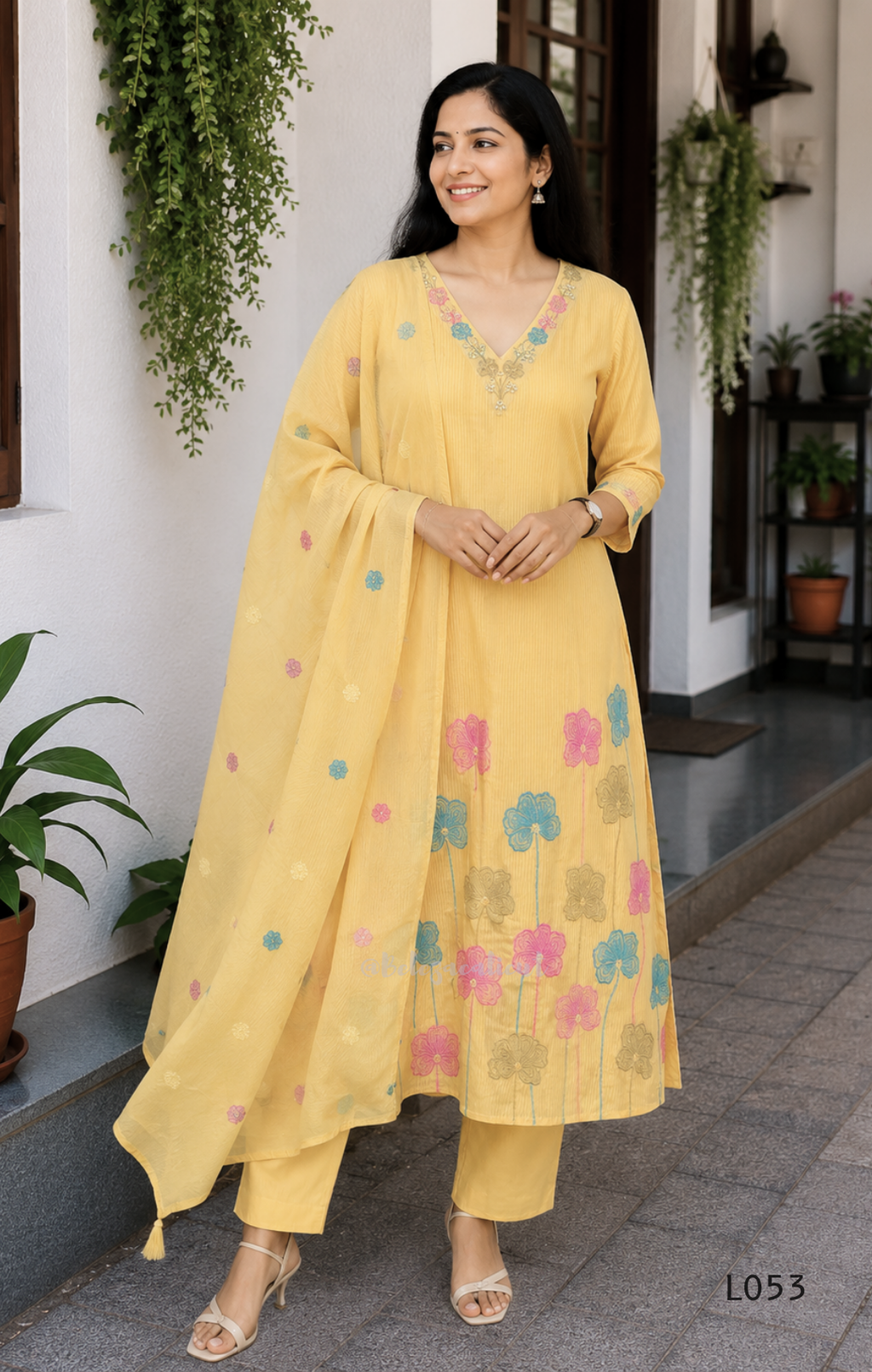 Cream mul cotton churidar set with lining, pastel pink and powder blue floral embroidery, matching dupatta, 3/4 sleeves and V-neck bead detail 