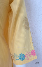 Cream mul cotton churidar set with lining, pastel pink and powder blue floral embroidery, matching dupatta, 3/4 sleeves and V-neck bead detail 