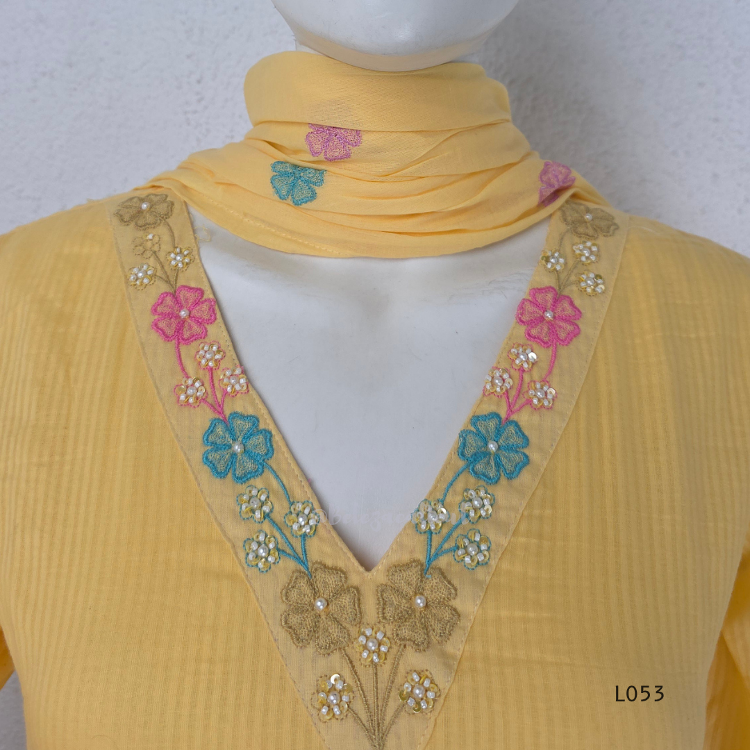 Cream mul cotton churidar set with lining, pastel pink and powder blue floral embroidery, matching dupatta, 3/4 sleeves and V-neck bead detail 