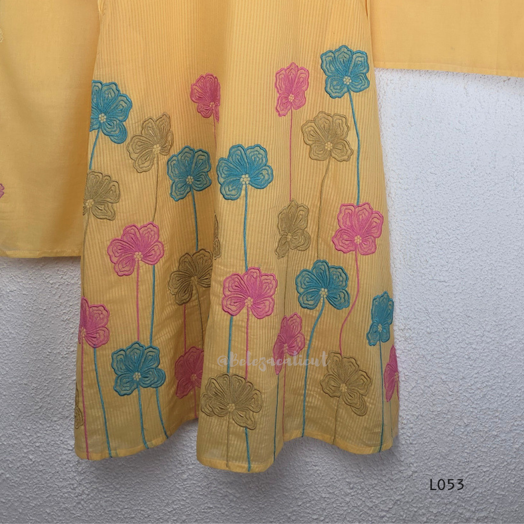 Cream mul cotton churidar set with lining, pastel pink and powder blue floral embroidery, matching dupatta, 3/4 sleeves and V-neck bead detail 