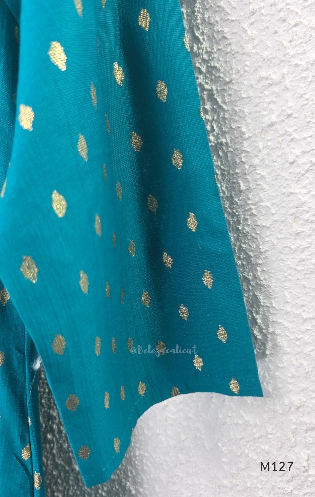 Peacock teal silk blend 3-piece churidar set with gold buti motifs, decorated V-neckline, plain matching bottom and gold-bordered dupatta.