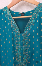 Peacock teal silk blend 3-piece churidar set with gold buti motifs, decorated V-neckline, plain matching bottom and gold-bordered dupatta.
