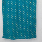 Peacock teal silk blend 3-piece churidar set with gold buti motifs, decorated V-neckline, plain matching bottom and gold-bordered dupatta.